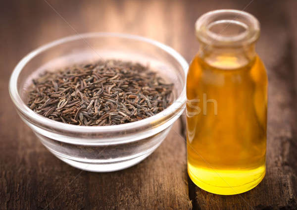 Caraway seeds with essential oil in glass bottle Stock photo © bdspn