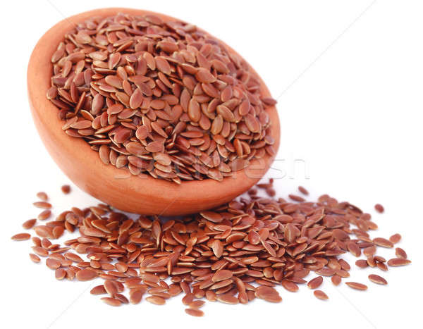Flax seeds with pottery Stock photo © bdspn