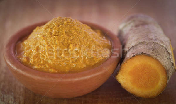 Mashed turmeric in a clay bowl Stock photo © bdspn