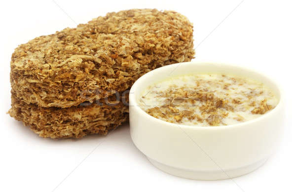 Oat cookies in milk Stock photo © bdspn