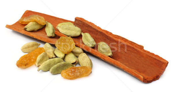 Cinnamon bark with cardamom seeds and raisin Stock photo © bdspn