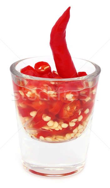 Red chili peppers in a transparent glass Stock photo © bdspn