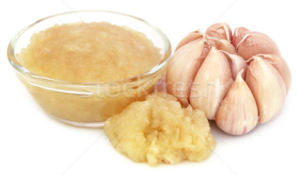 Stock photo: Mashed garlic with whole one