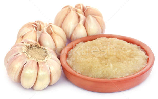 Crushed garlic with whole ones Stock photo © bdspn