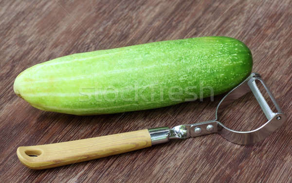 Fresh cucumber with peeler Stock photo © bdspn