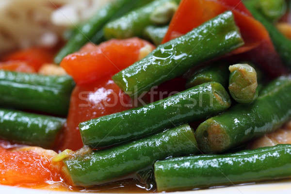 Striegeln lange Bean Essen Stock foto © bdspn