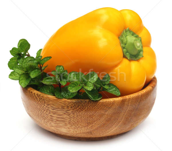 Yellow capsicum with mint leaves Stock photo © bdspn