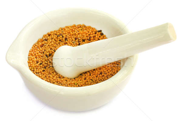 Mustard in a mortar with pestle Stock photo © bdspn