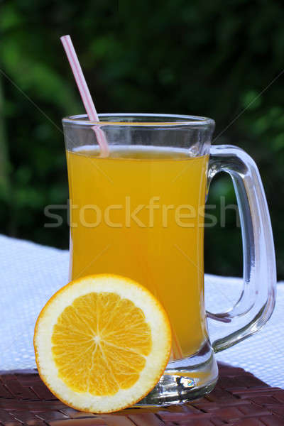 Orange juice with sliced orange Stock photo © bdspn