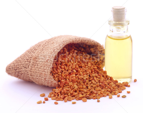 Fenugreek with oil in bottle Stock photo © bdspn