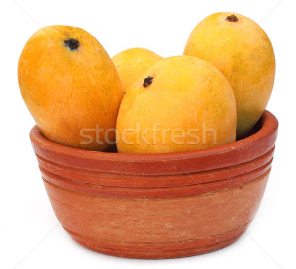 Fresh Mangoes on a clay bowl Stock photo © bdspn