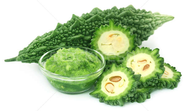 Green momodica with paste in a glass bowl Stock photo © bdspn