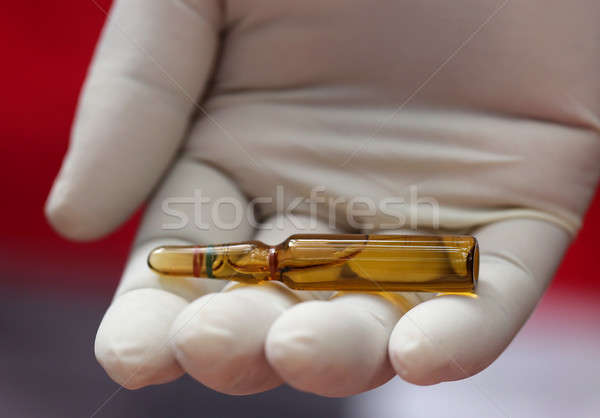 Close up of an ampoule holding by hand Stock photo © bdspn