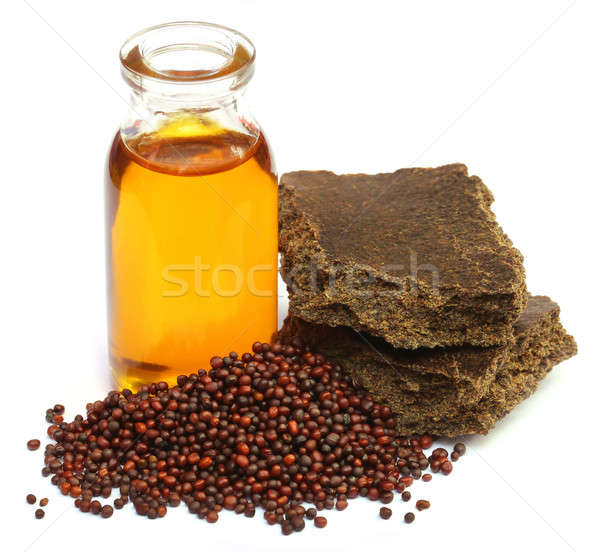 Mustard seeds oil and cake Stock photo © bdspn