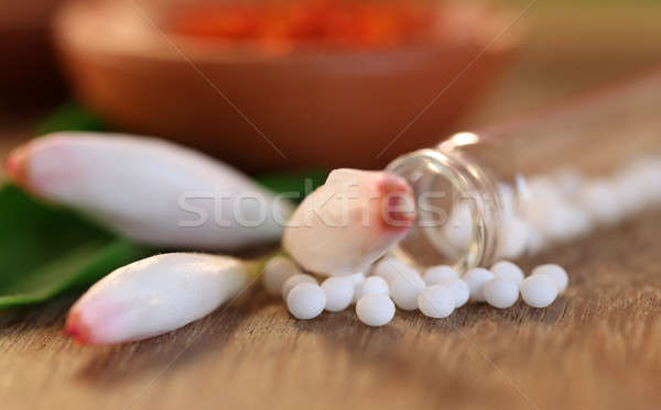 Homeopathy globules with herbal flower Stock photo © bdspn