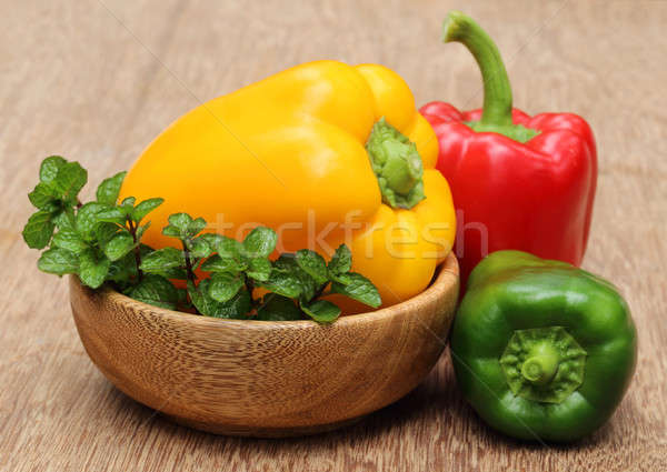 Capsicum with mint leaves on a bowl Stock photo © bdspn