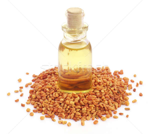 Fenugreek with oil in bottle Stock photo © bdspn