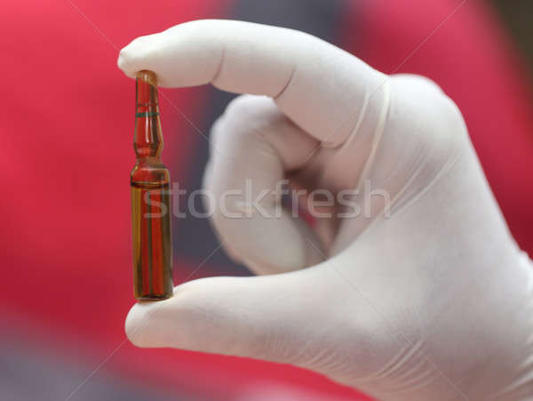 Close up of an ampoule holding by hand Stock photo © bdspn