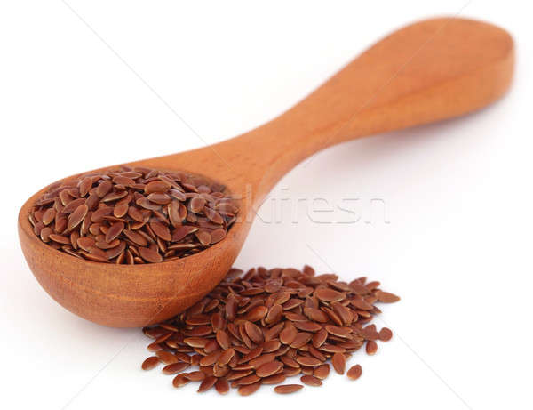 Flax seeds in a wooden spoon Stock photo © bdspn