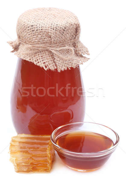 Honey in glass jar Stock photo © bdspn