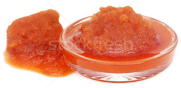 Molasses in a glass bowl over white background Stock photo © bdspn