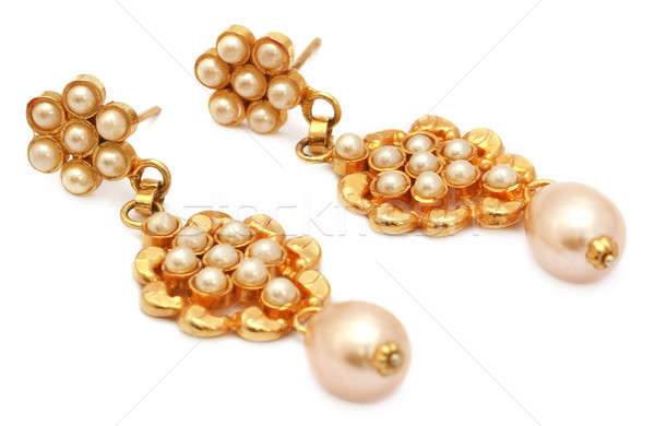 Earrings made of gold and pearls Stock photo © bdspn