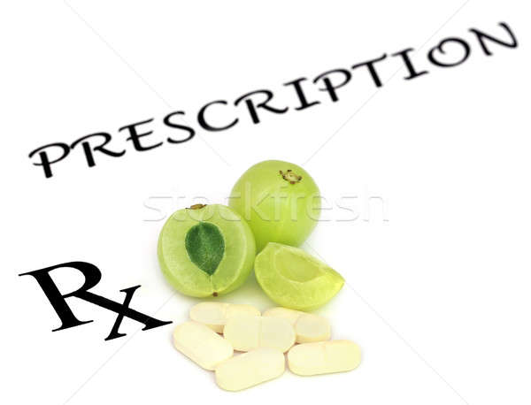 Amla fruits with pills Stock photo © bdspn