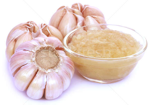 Crushed garlic with whole ones Stock photo © bdspn