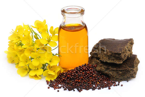 Mustard oil cake with flower Stock photo © bdspn