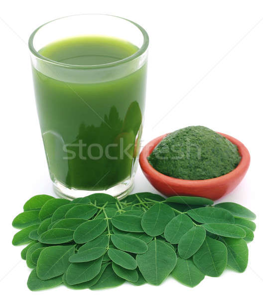 Moringa leaves with extract in a glass Stock photo © bdspn
