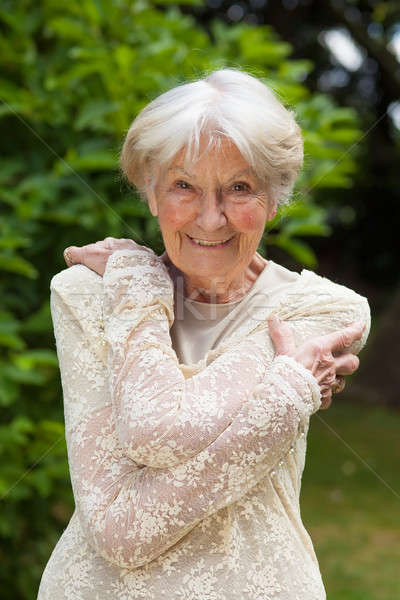 Attractive friendly elderly lady Stock photo © belahoche