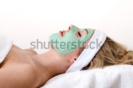 Blond woman enjoys facial beauty treatment.  Stock photo © belahoche