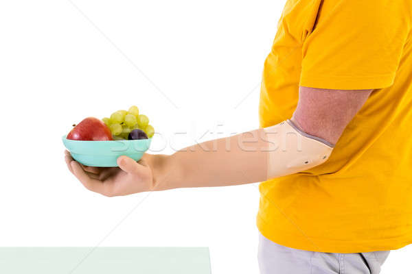 Człowiek ramię puchar owoców profil Zdjęcia stock © belahoche