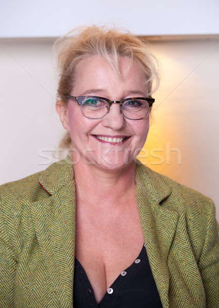 Smiling attractive middle-aged woman with glasses Stock photo © belahoche