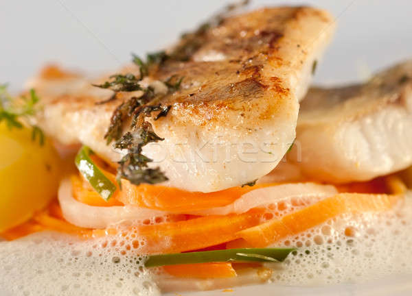 Fried pike perch fillet with vegetables.  Stock photo © belahoche