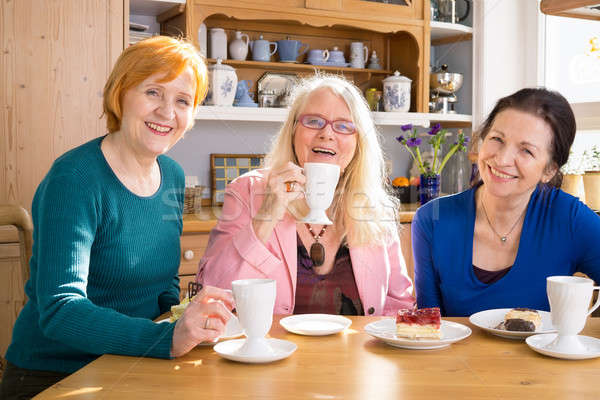 Smiling Mom Friends with Snacks Looking at Camera Stock photo © belahoche