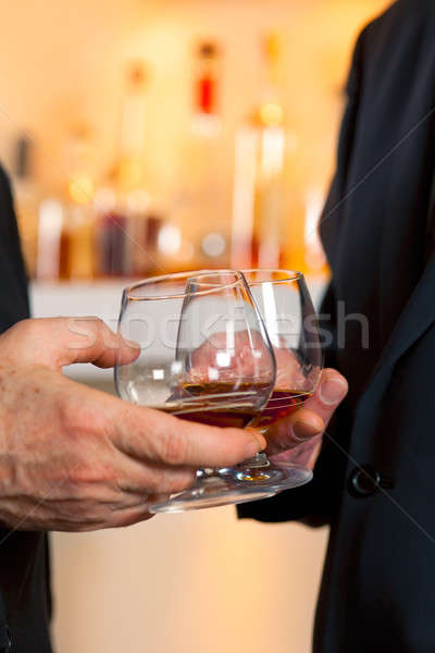 Szemüveg brandy buli kezek férfiak ital Stock fotó © belahoche