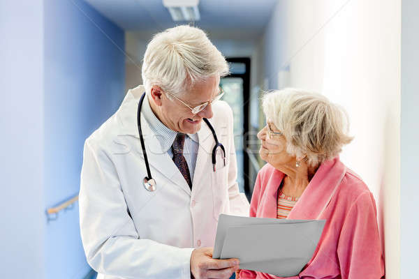 Doctor Talking to Old Woman about Good Results. Stock photo © belahoche