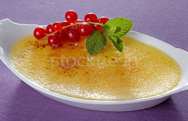 Crème brulee with red currant Stock photo © belahoche
