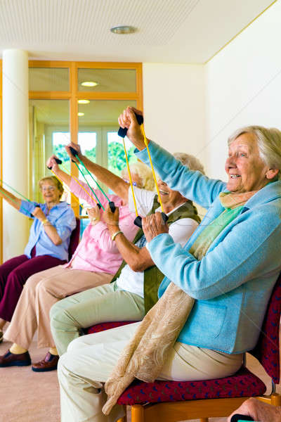 Senior women doing a workout in a gym Stock photo © belahoche
