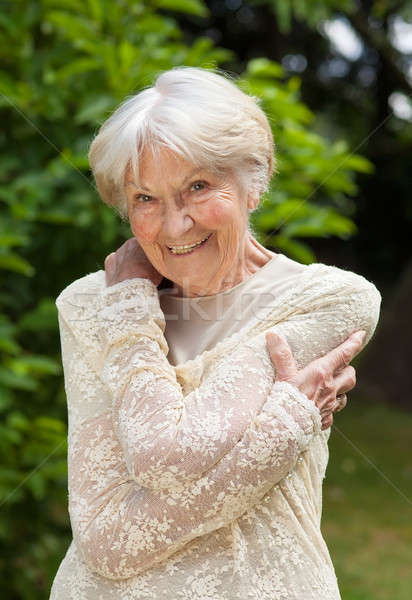 Smiling friendly senior woman Stock photo © belahoche