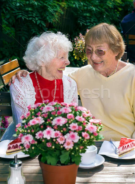 Two elderly ladies enjoying coffee together.  Stock photo © belahoche