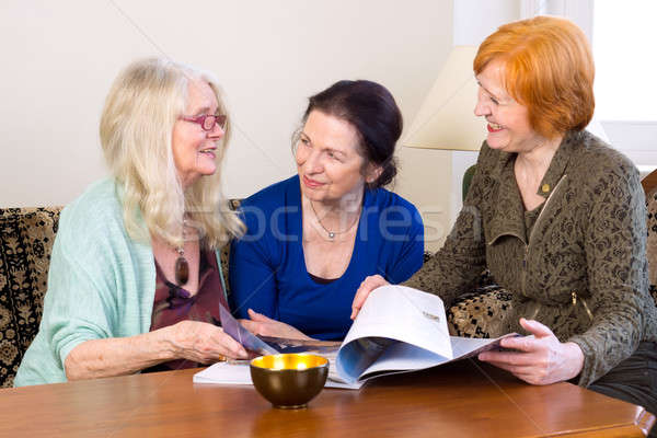 Middle Age Women Friends Talking at Living Area Stock photo © belahoche