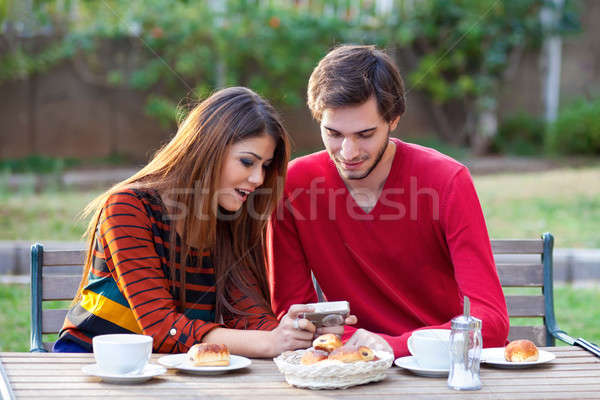 Young couple having coffee Stock photo © belahoche