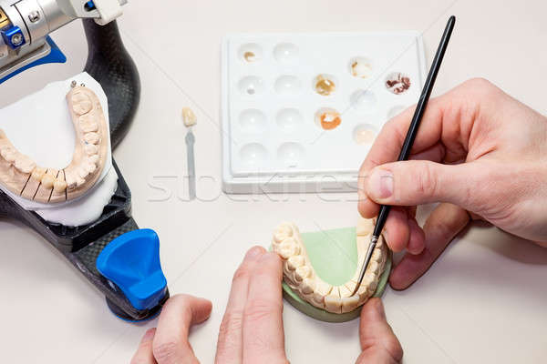 Making facial dental prosthesis on white table Stock photo © belahoche