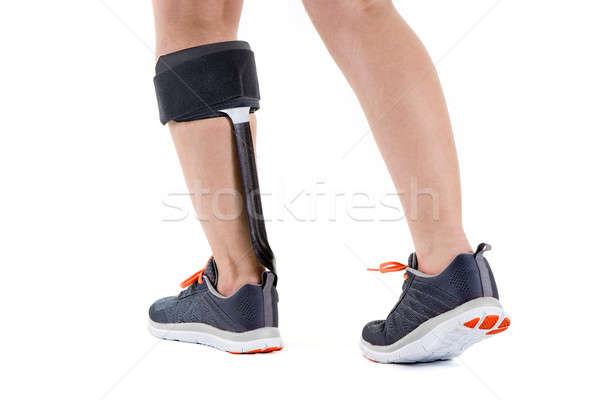 Person in Athletic Sneakers Wearing Brace on Calf Stock photo © belahoche