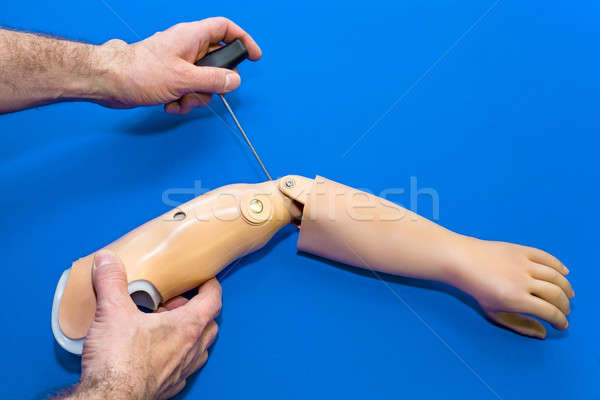 View of hands working on artificial arm Stock photo © belahoche