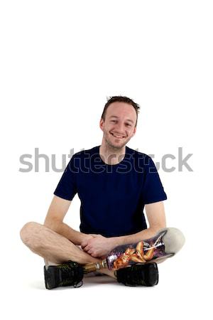Szczęśliwy pozytywny mężczyzna posiedzenia krzyż piętrze Zdjęcia stock © belahoche