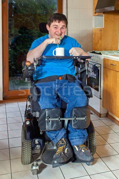 Young man with infantile cerebral palsy Stock photo © belahoche