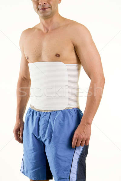 Shirtless Man Wearing Brace to Support Core Stock photo © belahoche